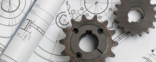 Gear wheels placed on technical drawings.